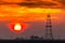 Abandoned oil and gas rig profiled on dramatic evening sky