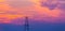 Abandoned oil and gas rig profiled on dramatic evening sky