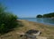 Abandoned old campfire site on shore of a large lake