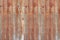 Abandoned old corrugated aluminum sheet with brown rustic texture for background