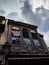 Abandoned old house in the old part of town - storm clouds looming above