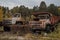 Abandoned old nearly collapsed radiative rusted huge trucks machines in Chernobyl ghost town