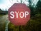 abandoned old stop sign on country road