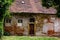 Abandoned old styled house with tile roofing