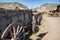 Abandoned Old West Log Buildings and Wooden Wagons