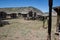 Abandoned Old West Log Buildings and Wooden Wagons