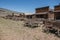 Abandoned Old West Log Buildings and Wooden Wagons