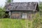 An abandoned old wooden house with a leaky roof