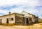 Abandoned One Story Building With Boarded Up Windows