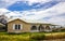 Abandoned One Story Home With Lattice In Disrepair