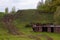 Abandoned part of the rusty iron ship - the rest of the industry of the Soviet Union in the wild forests of the tundra of Yakutia