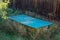 Abandoned ping pong table in overgrown garden