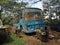 An abandoned private transport tata bus in blue colour