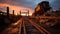 Abandoned railroad track vanishing into the tranquil sunset sky generated by AI