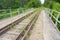 Abandoned railway, old overgrown railway tracks