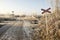 Abandoned railway track in freezing weather, rail crossing, sunny freezing weather, little dusting of snow