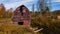 Abandoned Red Barn Overhanging in Creek - New York