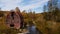 Abandoned Red Barn Overhanging in Creek - New York