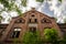 Abandoned red brick Roze school, Latvia