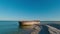 An abandoned reinforced concrete barge lies on a sandbank on the edge of the Kinburn Spit, Ukraine