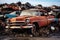 Abandoned relics rusting old cars in a junkyard signify environmental issues