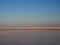 Abandoned remains of wooden structures on a salt lake