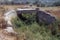 Abandoned road ancient overpass bridge over a withered pond