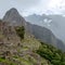 Abandoned ruins of Machu Picchu Incan citadel, the maze of terraces and walls rising out of the thick undergrowth, Peru