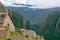 Abandoned ruins of Machu Picchu Incan citadel, the maze of terraces and walls rising out of the thick undergrowth, Peru