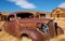 Abandoned, rusted out coupe. Bodie, California