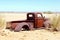 Abandoned rustic pickup car in desert, Africa