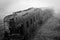 Abandoned rusting train photographed in a foggy day in the village of Paranapiacaba, Sao Paulo, Brazil.