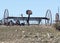 Abandoned, rusting vintage farm equipment in an open field