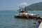 Abandoned rusty boat and old dredge