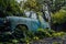 Abandoned rusty car in junkyard. Forgotten discarded rusty old blue car in scrapyard