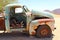 Abandoned rusty pickup car in desert, Africa