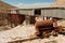 Abandoned salt mine and the rails in mountains of Central Asia under bright sun