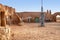 Abandoned set for the filming of Star Wars movie in the Sahara Desert against the backdrop of sand dunes.