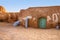 Abandoned set for the filming of Star Wars movie in the Sahara Desert against the backdrop of sand dunes.