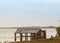 Abandoned shed shack at edge of coast water sea