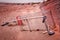 Abandoned shopping trolley trapped in the sand.