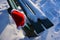 Abandoned snowy park bench with Santa hat for Christmas spirit.