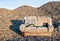 An abandoned sofa in a closed gravel pit that processed river stones