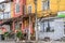 Abandoned Stores and Houses in a Poor Neighborhood in South Bulgaria, Europe. Multicolored Buildings in a Row