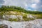 Abandoned talc quarry overgrown with trees