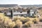 Abandoned trailers, appliances, tires and vehicles in the desert