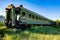 Abandoned train. Forgotten overgrown railway. Old rusty railway carriage