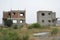 abandoned unfinished cottages made of concrete and brick.