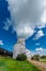 An abandoned vintage grain elevator in Battrum, Saskatchewan with a train beside it