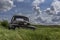 Abandoned vintage half ton pickup truck in the grass on the Canadian prairies